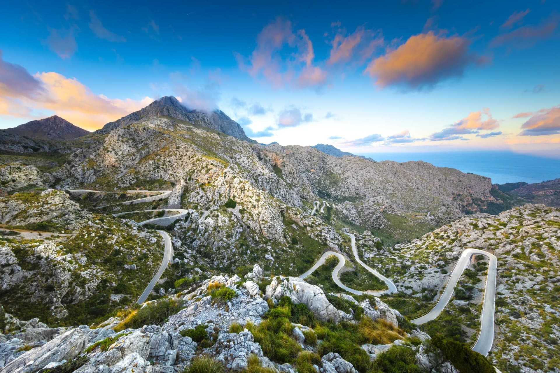 Winding mountain road descending rocky slopes toward the sea at Sa Calobra, Mallorca, Balearic Islands, Spain.